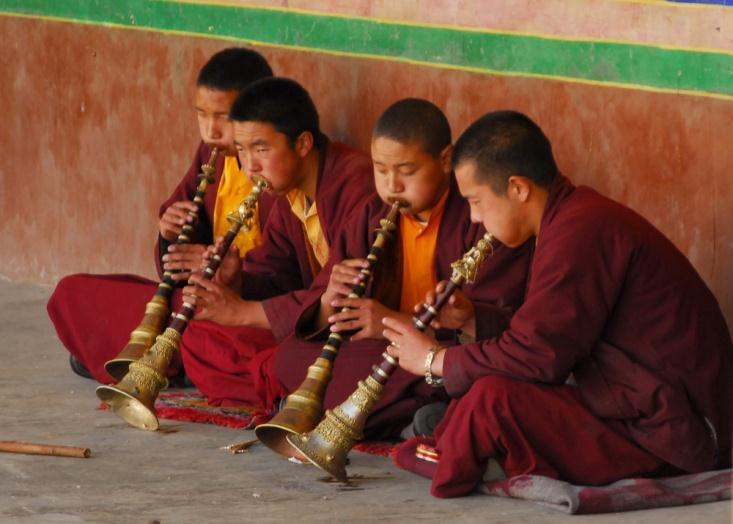 Boy monks playing gyalings at