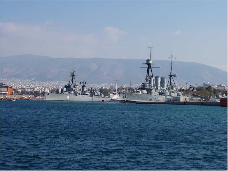 She is positioned between two former Greek naval vessels that are