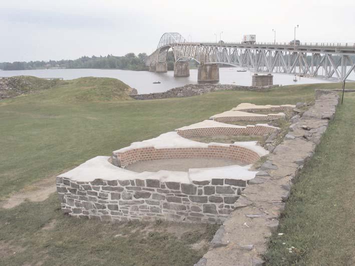 Behind the reconstructed remains of the French fortress s foundations, the modern Champlain Bridge crosses the strait between Crown Point, New York, and Chimney Point, Vermont. to the skies.