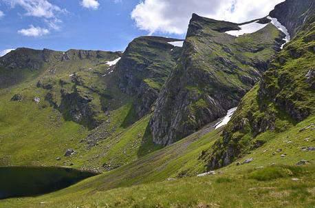 Creag Meagaidh is a magnificent massif, a bare plateau fringed by some of the grandest cliffs in Scotland 4pm - Transit
