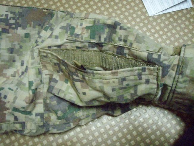 This is a much welcomed modification from normal style ACU or RAID breast pockets which open from the inside, thus making this pocket useless while wearing a vest.