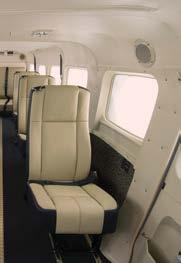 The Oasis interior offers folding tables, flat-panel video displays, a 110-volt power outlet and