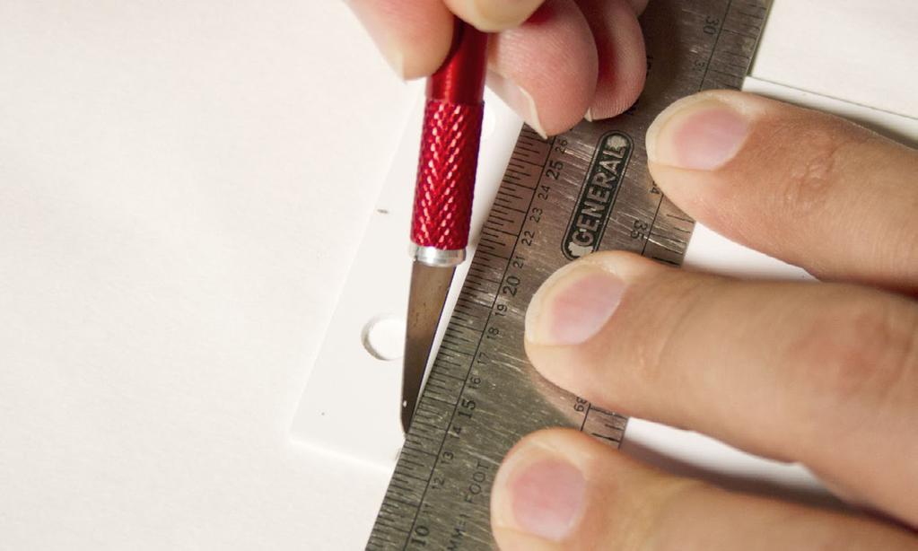 You will want to score the sheet using the straight edge of the scale ruler.