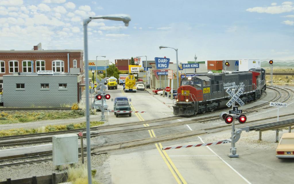 Above Left: Traffic waits for a UP intermodal as it heads through McDonald.