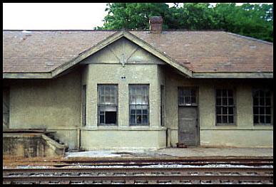 The original depot, built in 1873, sat across the tracks from this structure between main and side tracks leading to the GF&A north/side line.