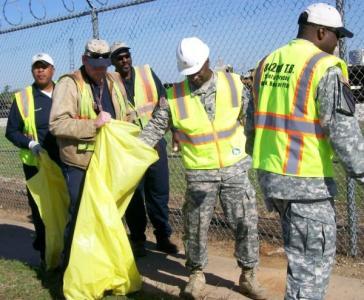 The group picked up trash and debris along the port s property line from the main gate for about one mile along two city