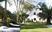 Accommodations: Day 1: : A small boutique lodge near Arusha, surrounded by