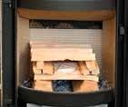 Start by placing a couple of logs, approzimately ½ kilogram, in the bottom of the burn chamber.