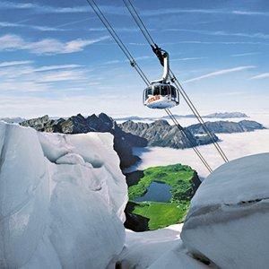 Titlis Drive to Alpine Engelberg - very famous sport center of Central Switzerland - to take the Titlis-Rotair, the world's first revolving cable car, up to 10,000 feet where eternal snow resists