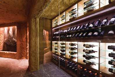 TV, feature storage and heated boot warmers Walk-in wine cellar with floor to ceiling