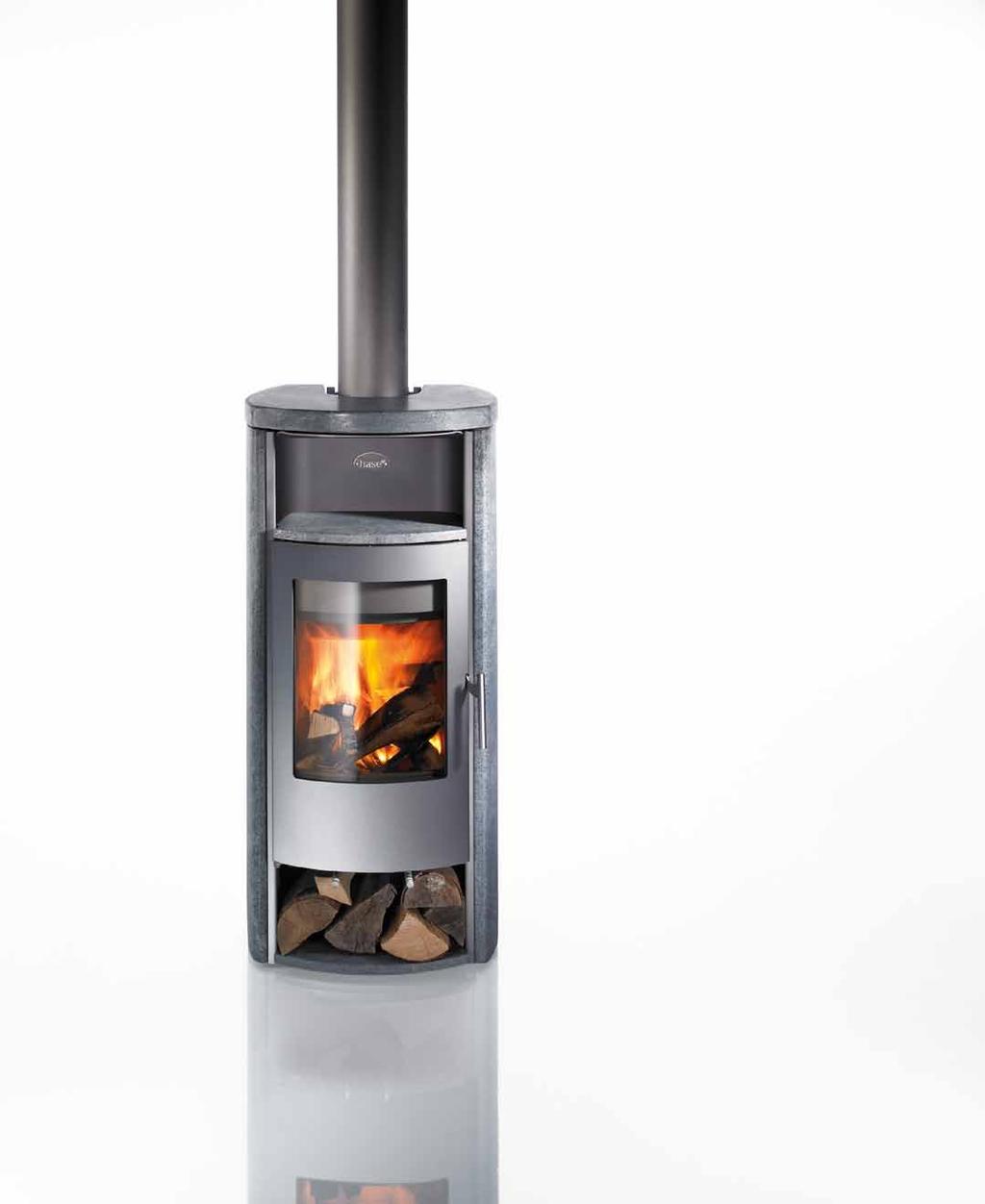 Jena The Jena stove is distinguished by its harmonious, balanced proportions and practical three-compartment design: Wood can be stored below the fire box, while the upper warming compartment keeps