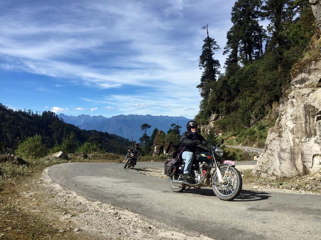 After Indian formalities, it is on the bikes and back into the foothills of the Himalaya, where we will stop for a packed lunch, then ride through endless tea plantations, following the road as it