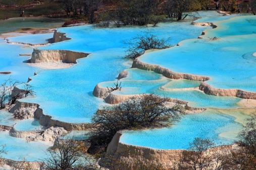 Day 14: Nine Villages Valley Huanglong - Chengdu Drive around 4 hours to the Huanglong Temple and Huanglong pools where you will find hundreds of vivid pools in stiking colours, formed by thousands