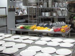kitchen complex that boasts the latest in food preparation equipment, which allows the chef and kitchen staff to prepare and serve gourmet meals for dinners of up to 4,000 guests.