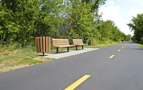 Section V Design and Implementation Rest Stops Rest stops are generally located every mile and provide places for trail users to stop and rest along the trail and an area for amenities such as trash