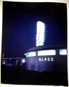 Lot # 220 - Large Format Color Transparency of a Night shot of the Glass Building. This is an original period transparency on Cellulose Acetate (Kodachrome). Size: 7 7/8" wide by 9 7/8" high.