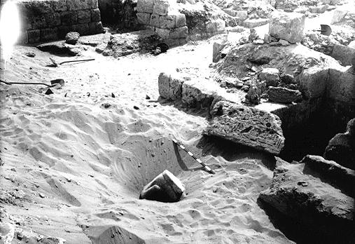 121a. 2240: excavation photo, showing headless seated scribe