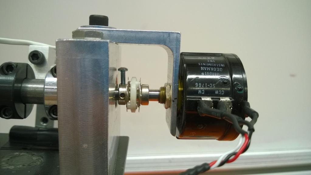 They are used to measure the vertical and horizontal angles of the attached aircraft. The potentiometers are mounted with aluminum L-brackets and flexible couplings to avoid binding see Fig.