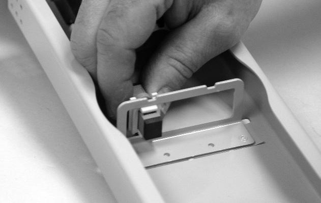 Insert two screws (supplied with basket) through the holes in the bottom of the basket, and through the corresponding two holes in the tray bracket. Tighten screws completely. (Figure 3) 3.