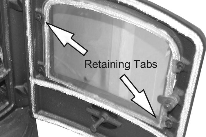 In the event of the glass being broken, it can be removed by unscrewing the retaining tabs, taking care not to damage the fireproof rope seal.