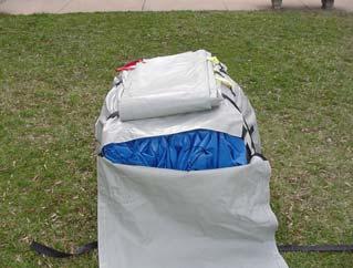 Do not over tighten the compression belt strap around the center of the shelter when compacting the shelter for re-packing in the transport bag.