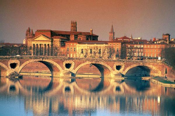 (Toulouse) Reboard coach and continue on to Toulouse, know as La Ville Rose (the pink city) for the lovely shade of stone used for much of the medieval architecture and built along the Garonne River.