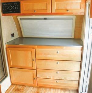 The front of the trailer features cabinetry and a