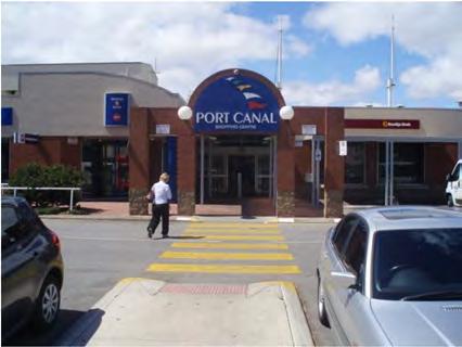 Pedestrian access at the Port Canal shopping is provided through the car parking area or via a section of former east-west internal road through the shopping centre, as shown in Figure