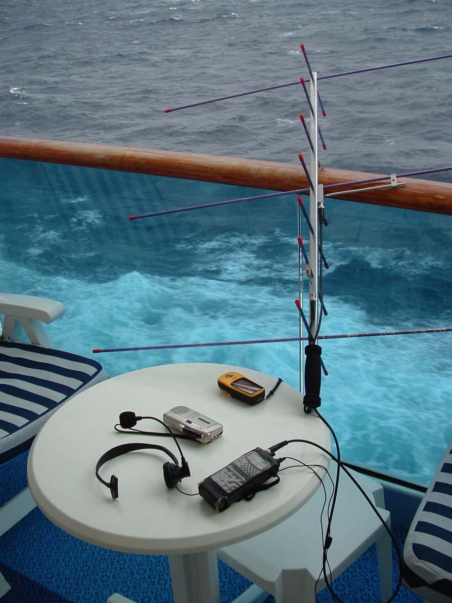 Using an Arrow Antenna Lessons Learned on Nine Cruises Equipment spread out on the table of the veranda in preparation to work a satellite pass from a