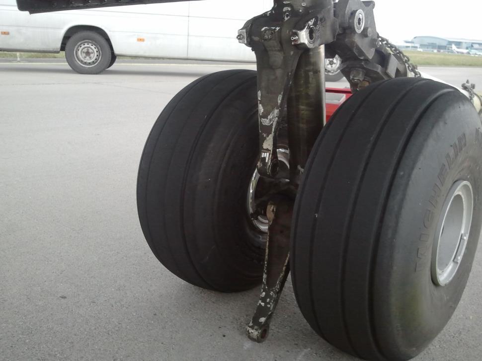 The nose landing gear was photographed (Photo No. 1) and the aircraft was then towed to a hangar for further inspection. Photo No. 1: Separated Torque Links 4 1.