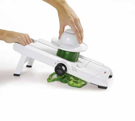 Hand-Held Mandoline Slicer Three slice thickness settings Clear window shows slices below Slice on cutting