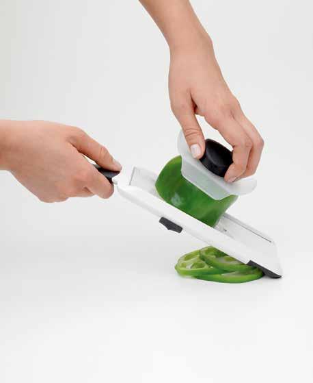 Hand-Held Mandoline Food holder protects hands while slicing Non-slip feet for