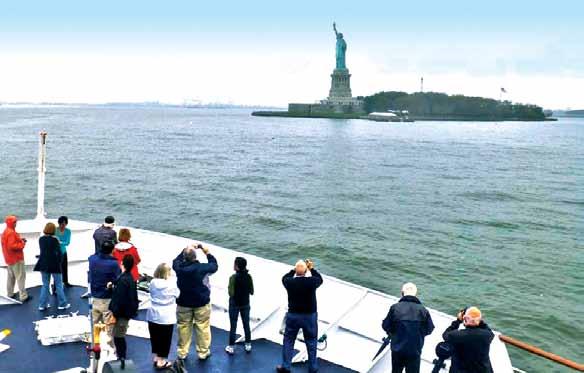 Yorktown sails past the Statue of Liberty in New York Harbor Cruise, Learn & Be Inspired This voyage is accompanied by an experienced team who