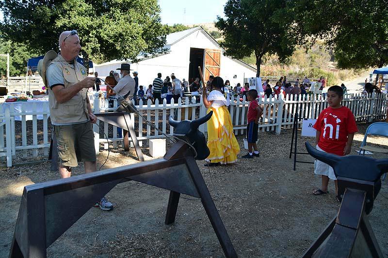 Members of FOSTP are very thankful to have his presence and support on the board. The picture below shows Greg volunteering to show a young guest how to rope a wooden horse at the 2013 Fandango.
