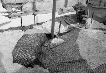 When the filling had been completed, a separation geotextile was The House of the Arrephoroi. Construction of reinforced embankment with wrap around face formation. Photo D.