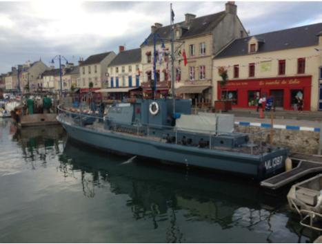 Alongside the quay in Port en Bessin There was another memorable moment here that defined the trip. As we left the next morning there was a solitary man stood on the lockside.