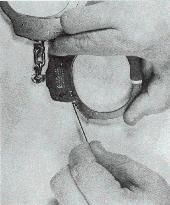When was the last time you checked this before taking a car out? The pictures in Figures 41 and 42 show a ball point pen's Insides and the cuffs being opened by a key fashioned from this pen.