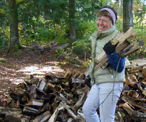 Northeast Kingdom Section member Cathi Brooks stacking wood at Wheeler Pond More than 40 volunteer corridor monitors regularly walked and marked protected trail corridor boundaries to ensure that