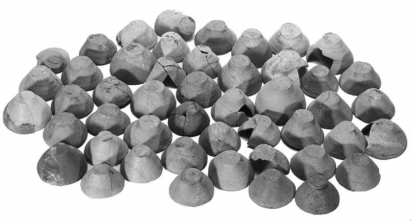 Fig. 21b. Conical cups from Room XIX the pottery workshop.