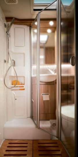 The extremely roomy comfort bathroom not only boasts a separate shower with fixed walls but also allows