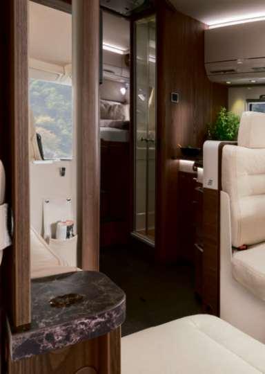 Luxury class Hymermobil B-Class SL 96 Living area and kitchen 97 Long bench seats.