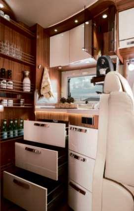 The elegant kitchen unit for instance boasts a large, low-level work surface, larder
