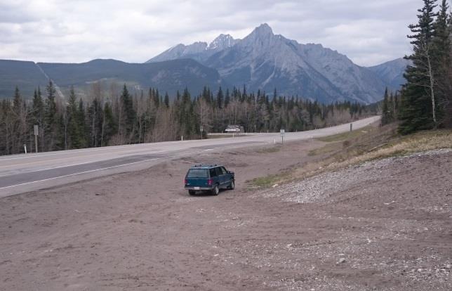 Parking with the Nakiska turnoff sign in the background Looking down the gravel drainage Using This Guide Using this