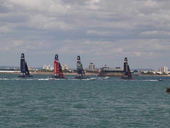 From the flight deck we were yards from the America s cup boats as they were being prepared and lowered into the water.