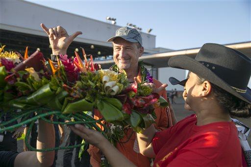 approaches  (Jean Revillard/SI2 via AP) Pilot Andre Borschberg flashes a Hawaiian shaka at the crowd after he landed the Solar Impulse 2 at the Kalaeloa Airport,
