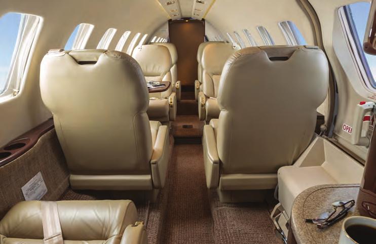 Seating is fire blocked and finished in Taupe Leather Seats in a Four Place Center Club Arrangement with Partial Floor Tracking, One Aft Facing Seat located in Fwd Main Cabin, Two Forward Facing