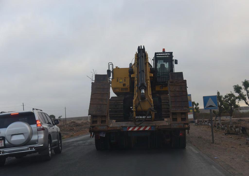 An excavator en route to the mine site on