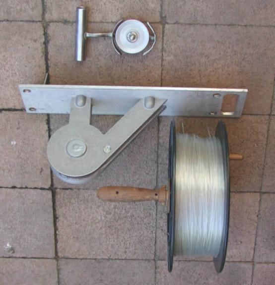 These are the typical components of a reflex tow system (minus stakes). There is around 400 m of 150lb breaking strain monofilament line, a turnaround pulley and a handtow pulley.