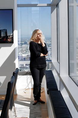Michal Czerwonka for The Wall Street Journal Close to the Action: Sharon Hernandez, pictured, and her husband bought a 2,200-square-foot two bedroom so they could be closer to sports games.
