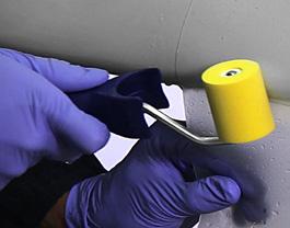 Wet outer tape surface with application solution, squeeze out application solution and air with a rubber squeegee chord-wise upwards and downwards from leading edge towards tape edge.